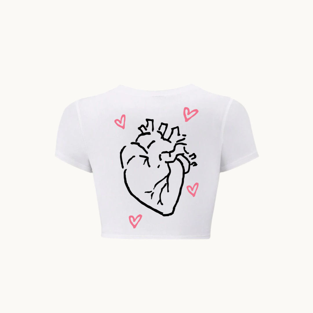 White cropped t-shirt featuring a minimalist illustration of an anatomical heart surrounded by pink hearts - SKULLMASK